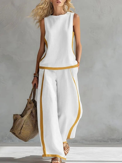 Ensemble décontracté : haut ample sans manches à col rond et pantalon large fluide à taille haute.