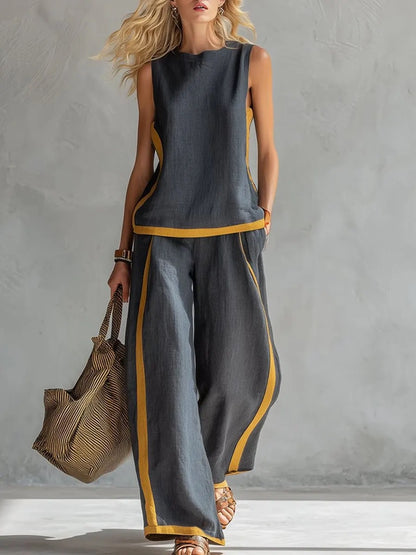 Ensemble décontracté : haut ample sans manches à col rond et pantalon large fluide à taille haute.