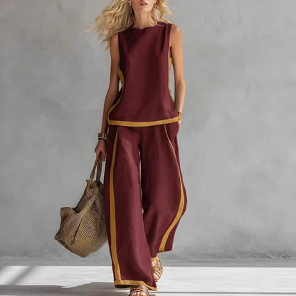 Ensemble décontracté : haut ample sans manches à col rond et pantalon large fluide à taille haute.