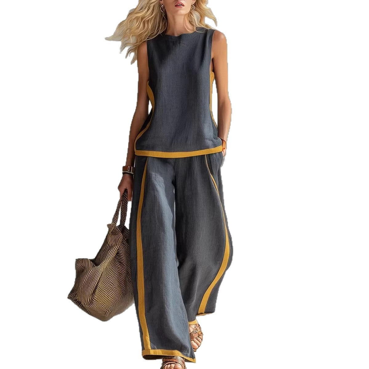 Ensemble décontracté : haut ample sans manches à col rond et pantalon large fluide à taille haute.