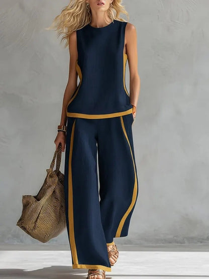 Ensemble décontracté : haut ample sans manches à col rond et pantalon large fluide à taille haute.