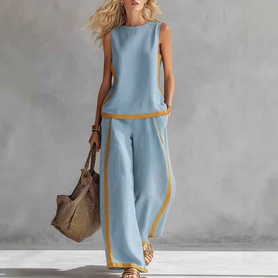 Ensemble décontracté : haut ample sans manches à col rond et pantalon large fluide à taille haute.