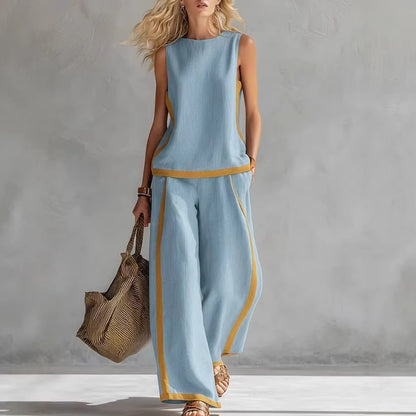 Ensemble décontracté : haut ample sans manches à col rond et pantalon large fluide à taille haute.